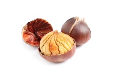 Photo of Delicious sweet roasted edible chestnuts isolated on white