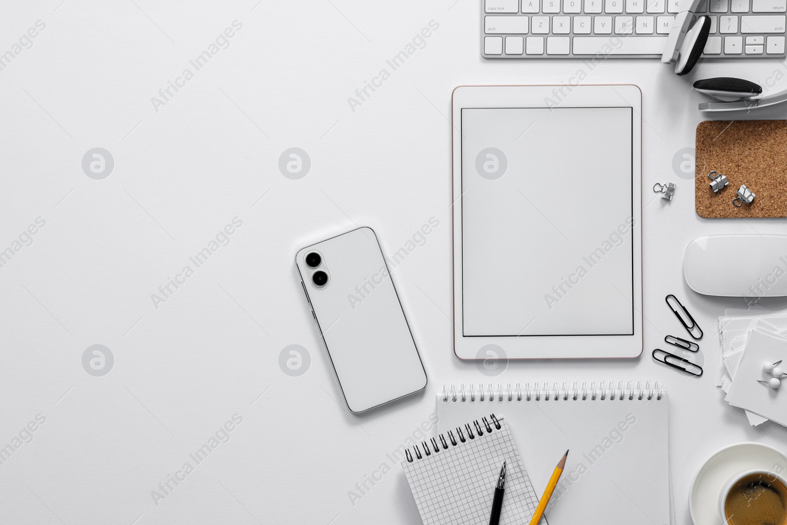 Photo of Flat lay composition with modern tablet on white background. Space for text