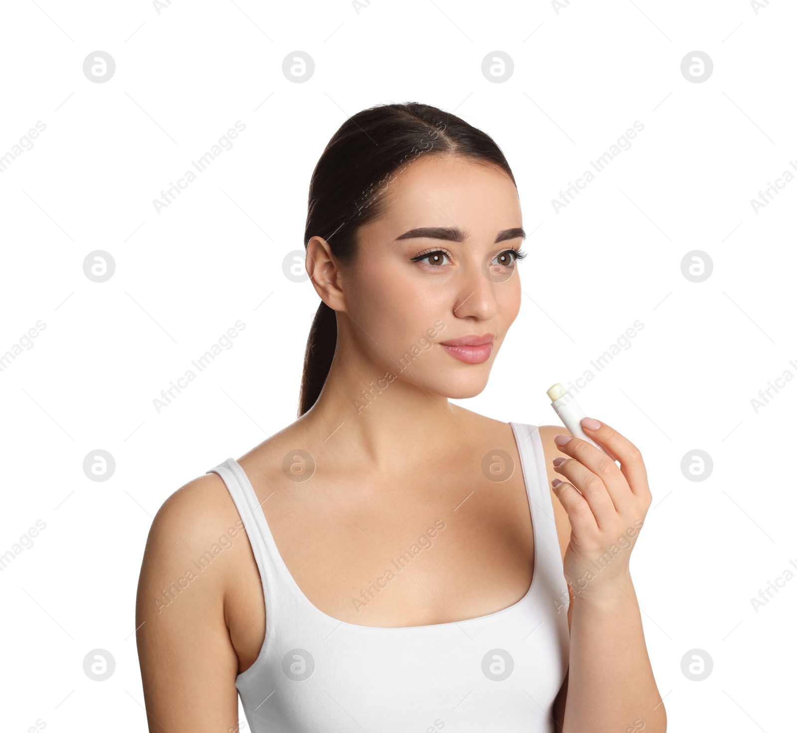 Photo of Young woman with lip balm on white background