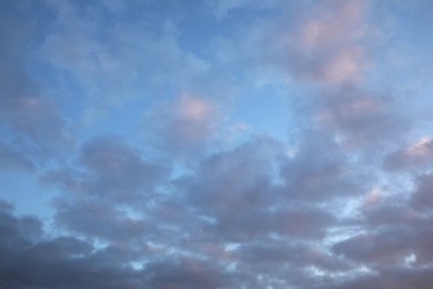 Beautiful blue sky with many dark clouds. Stormy weather