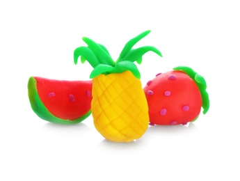 Photo of Small pineapple, watermelon and strawberry made from play dough on white background