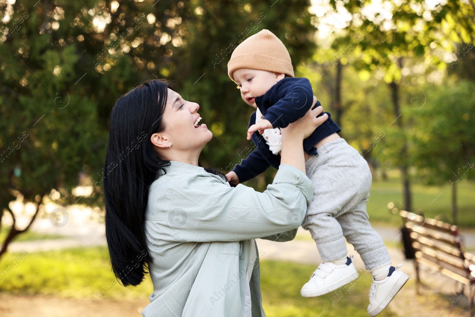 Photo of Happy mother having fun with her baby in park