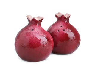 Photo of Pomegranate shaped salt and pepper shakers isolated on white