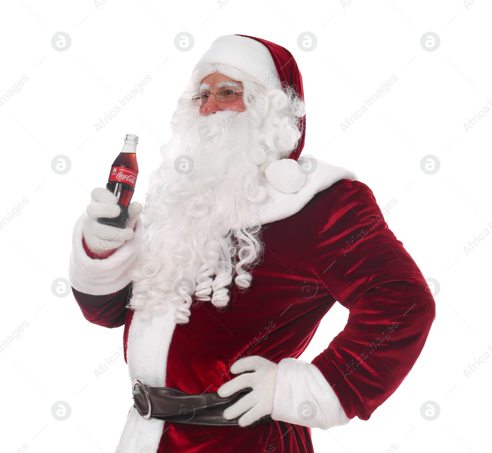 Photo of MYKOLAIV, UKRAINE - JANUARY 18, 2021: Santa Claus holding Coca-Cola bottle on white background