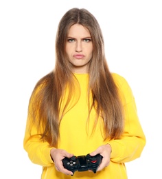 Emotional young woman playing video games with controller isolated on white