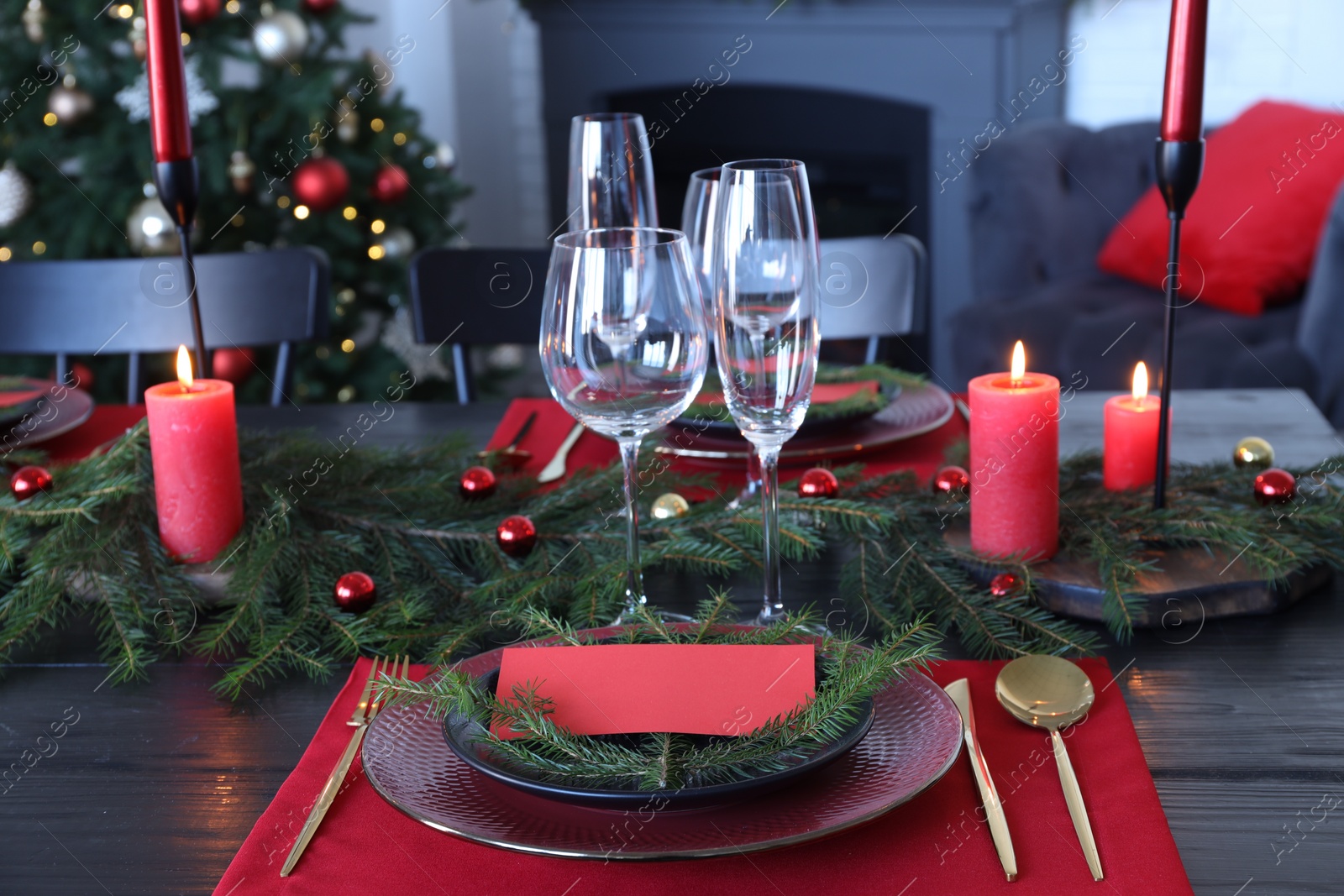 Photo of Elegant Christmas table setting with blank place card and festive decor