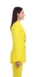 Businesswoman in yellow suit standing on white background