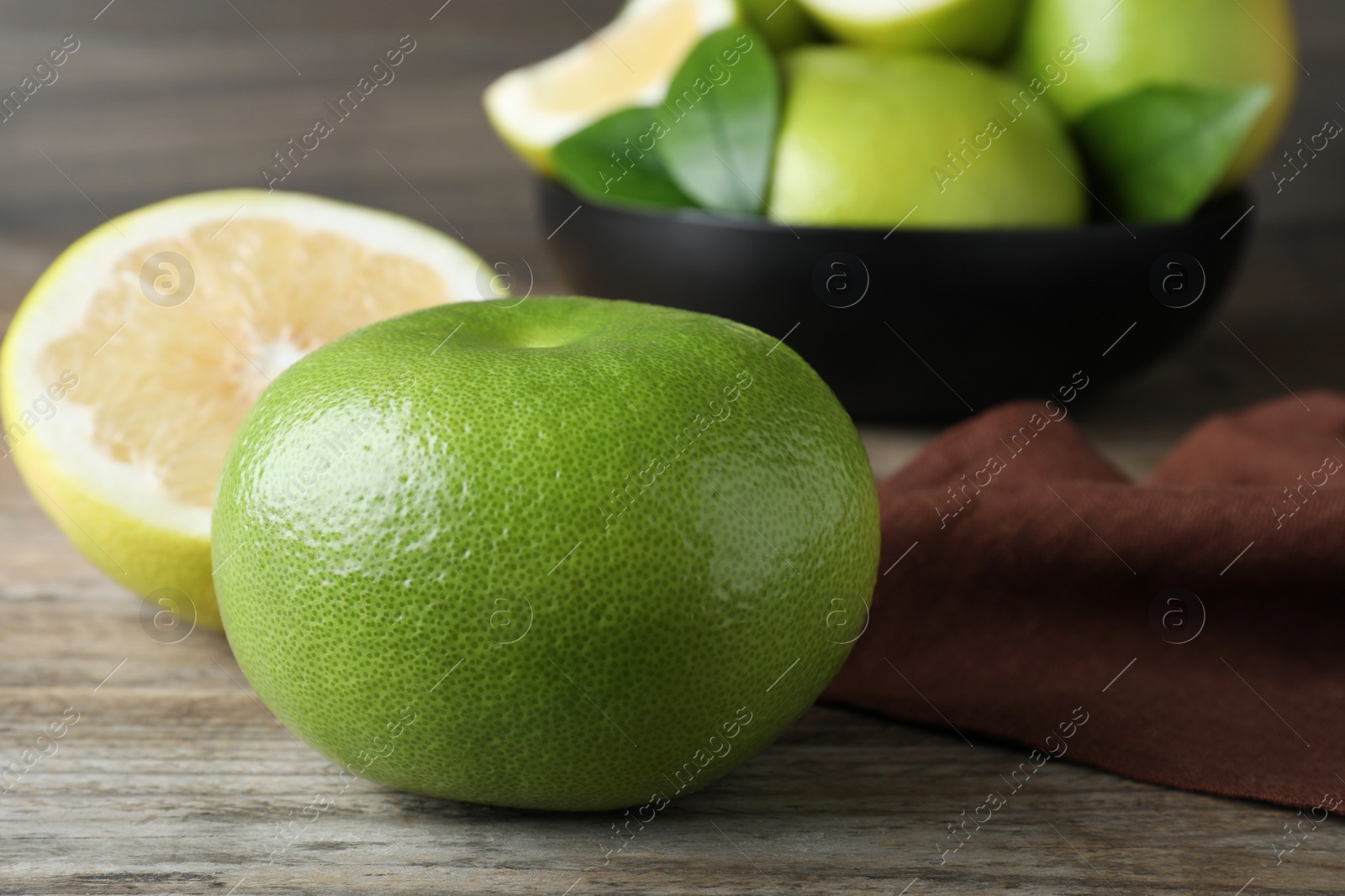 Photo of Fresh ripe sweetie fruit on wooden table