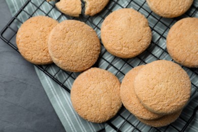 Delicious sugar cookies on black table, top view