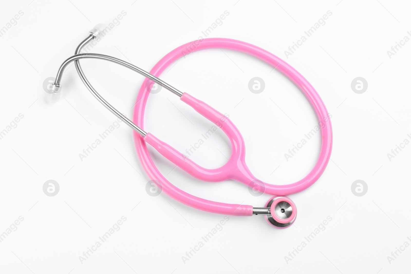 Photo of Pink stethoscope isolated on white, top view. Breast cancer awareness