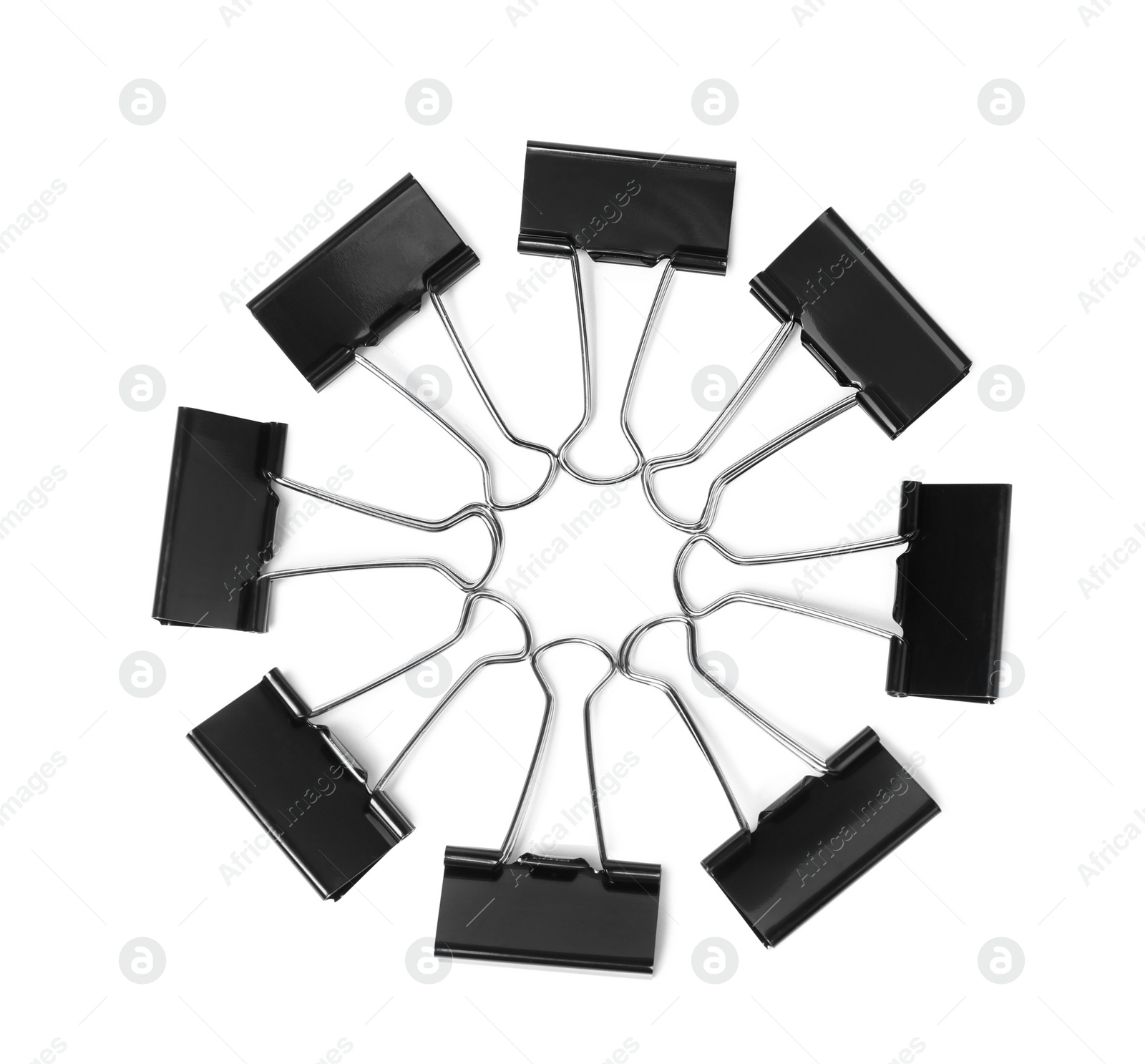 Photo of Black binder clips on white background, top view