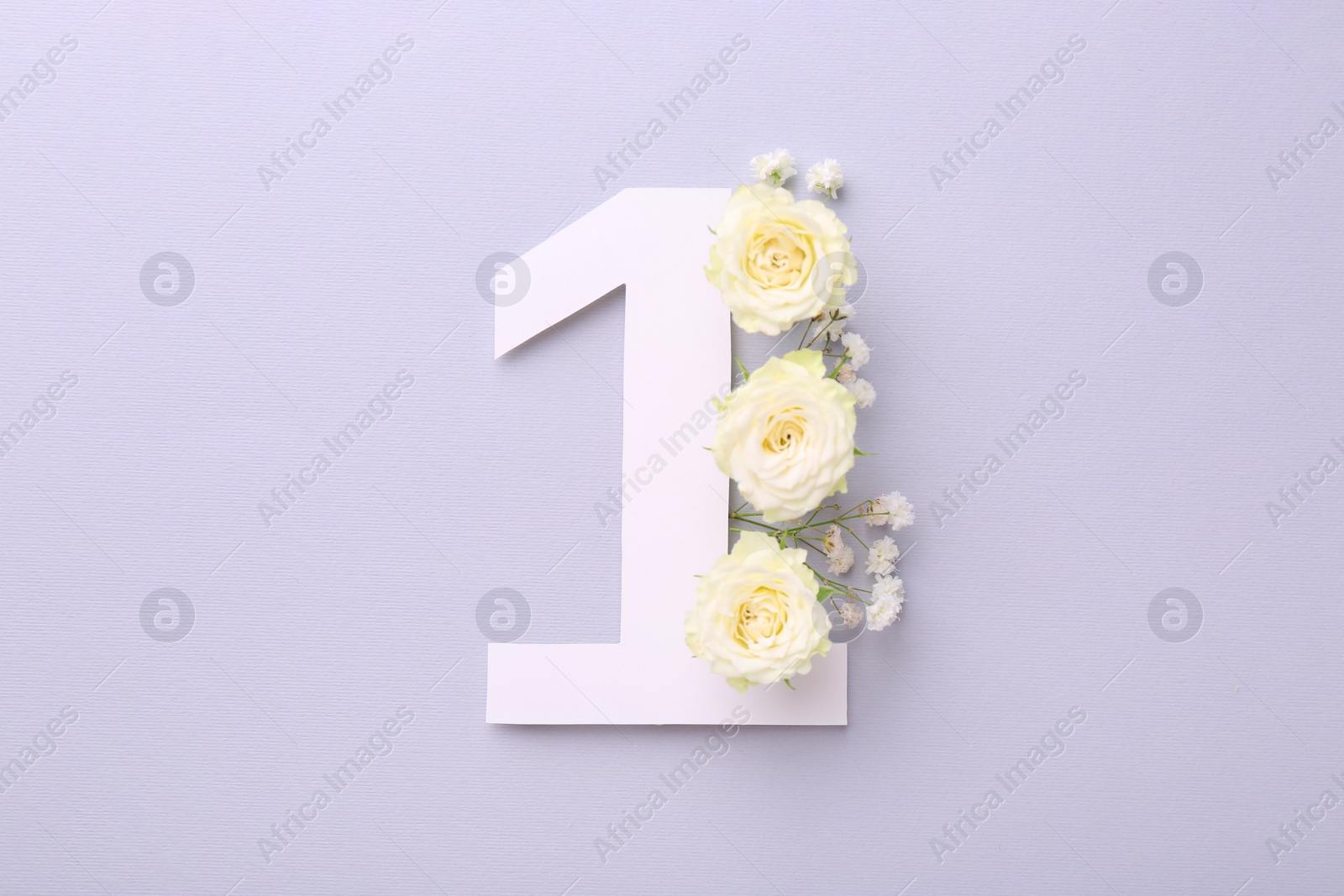 Photo of Paper number 1 and beautiful flowers on light grey background, top view