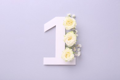 Paper number 1 and beautiful flowers on light grey background, top view