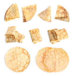 Set of delicious thin pancakes on white background, top view