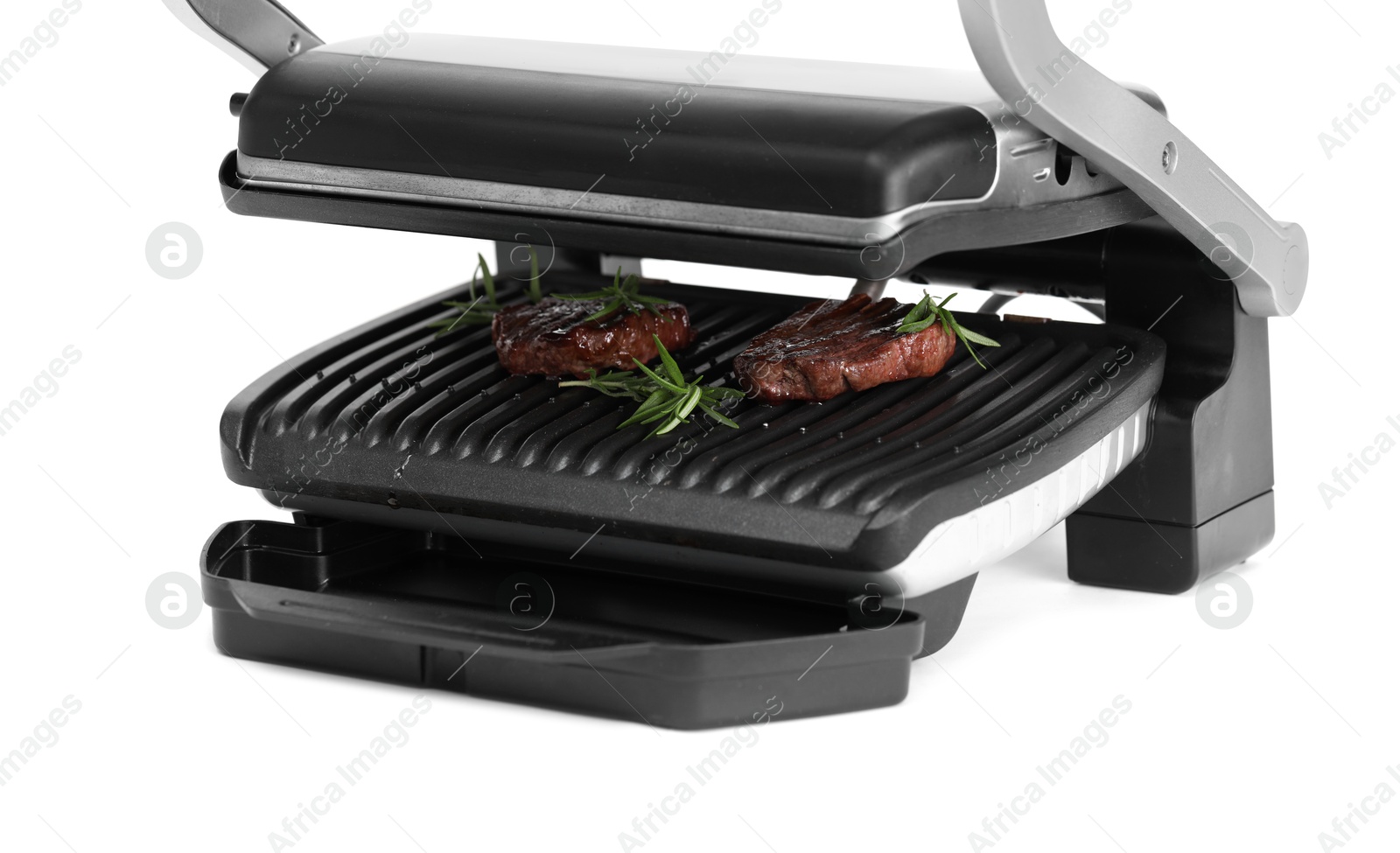 Photo of Electric grill with tasty meat steaks and rosemary isolated on white