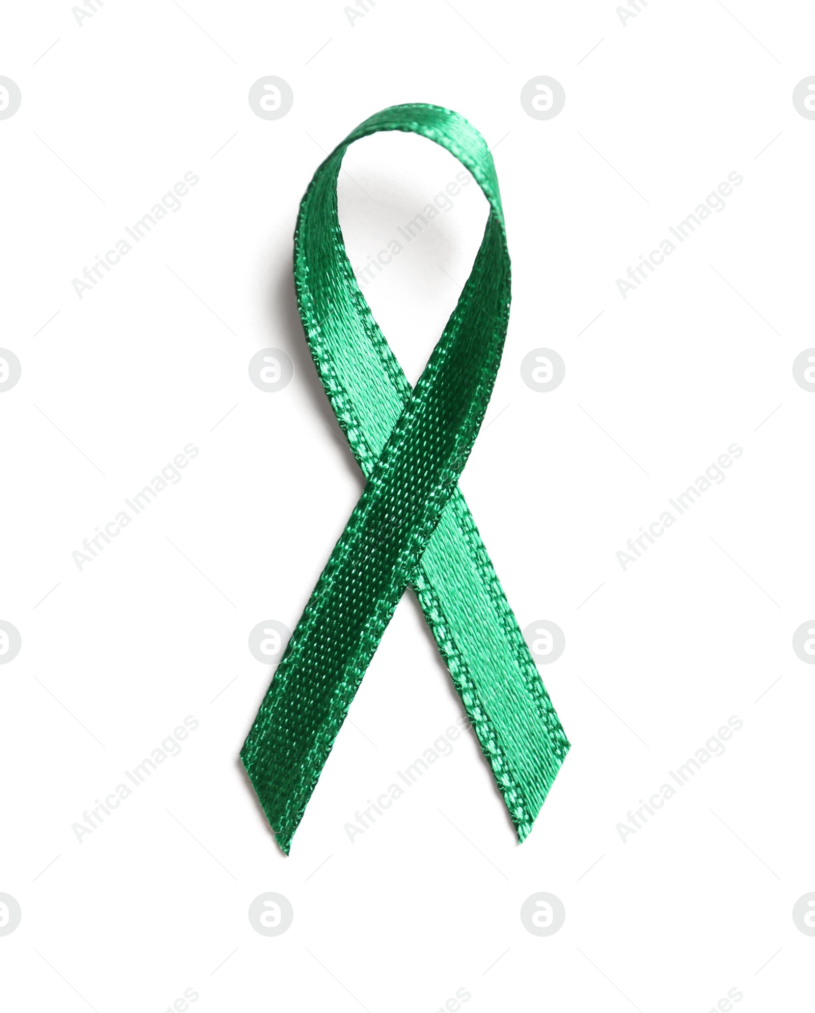 Photo of Green ribbon on white background, top view. Cancer awareness