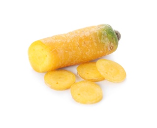 Photo of Pieces of raw yellow carrot isolated on white