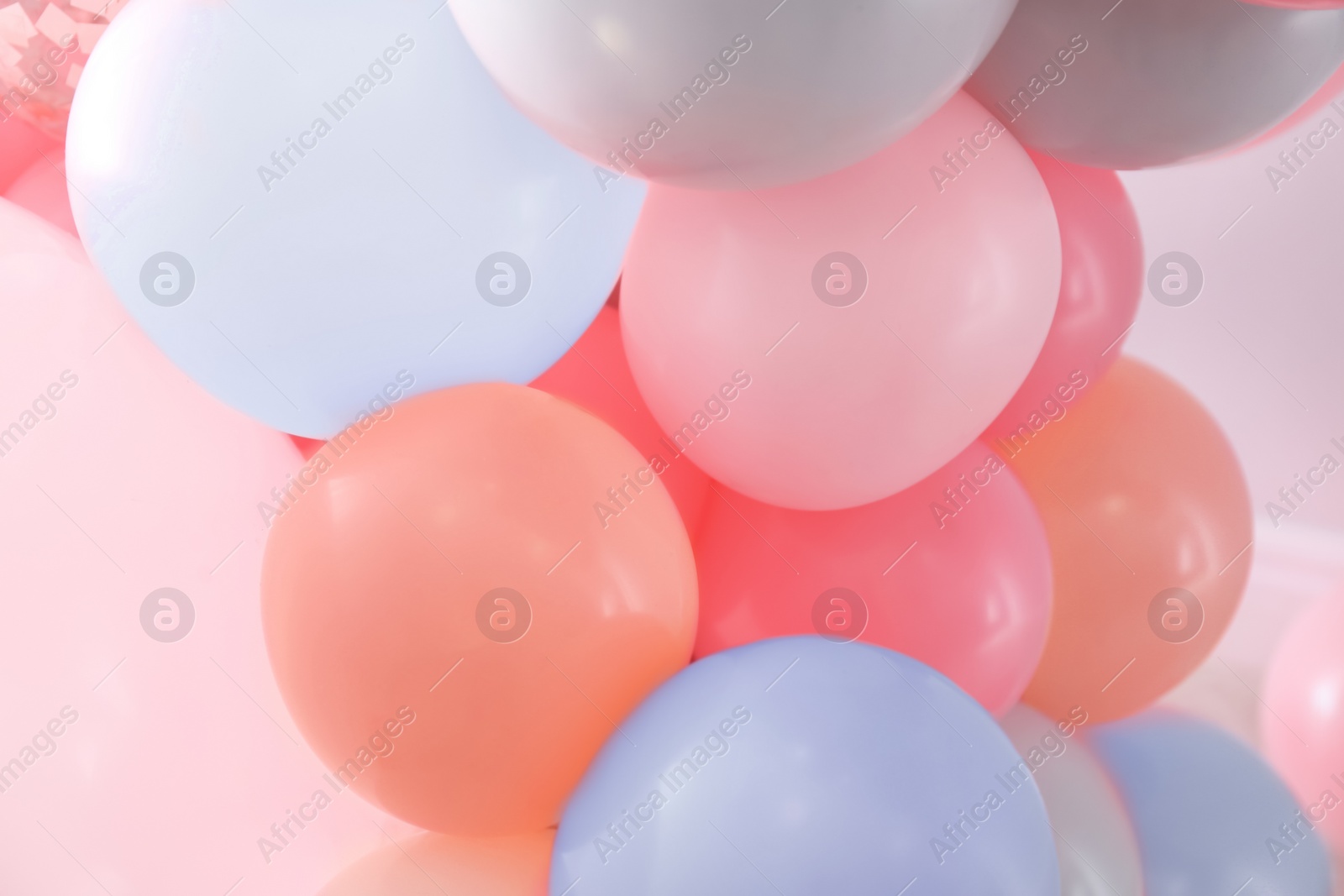 Image of Beautiful colorful balloons on light background, closeup. Party decor 