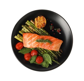 Photo of Tasty grilled salmon with tomatoes, asparagus, spinach and spices isolated on white, top view