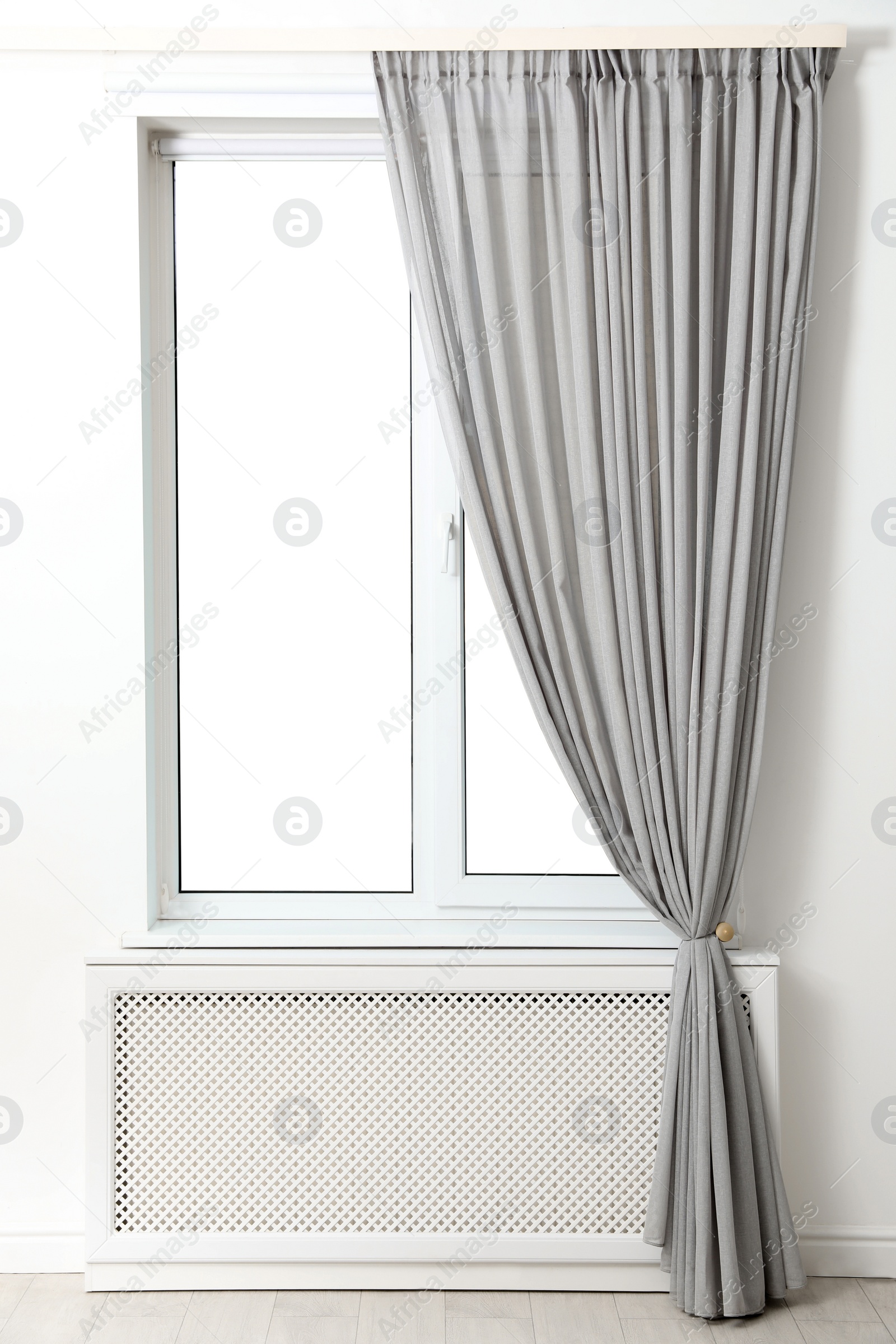 Photo of Modern window with beautiful curtains in room