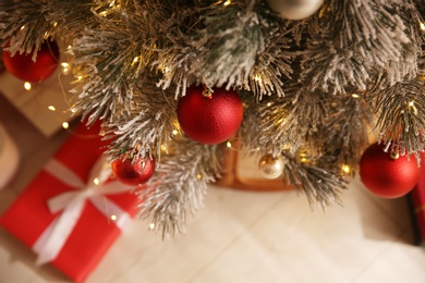 Photo of Beautiful Christmas tree with decor indoors, above view