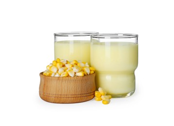 Photo of Tasty fresh corn milk in glasses and kernels on white background