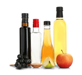 Photo of Composition with different kinds of vinegar and ingredients on white background