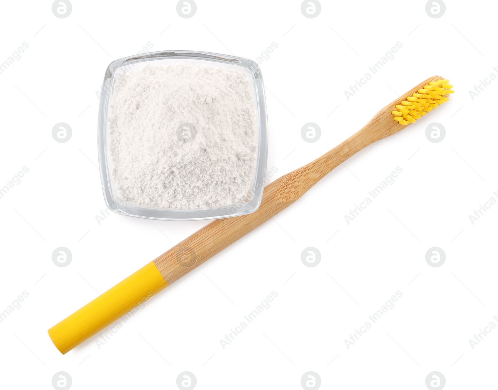 Photo of Bowl of tooth powder and brush on white background, top view