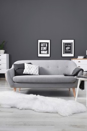 Photo of Cozy living room interior with comfortable sofa