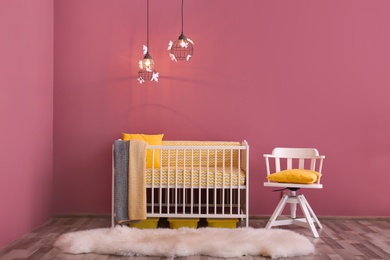 Photo of Modern baby room interior with crib