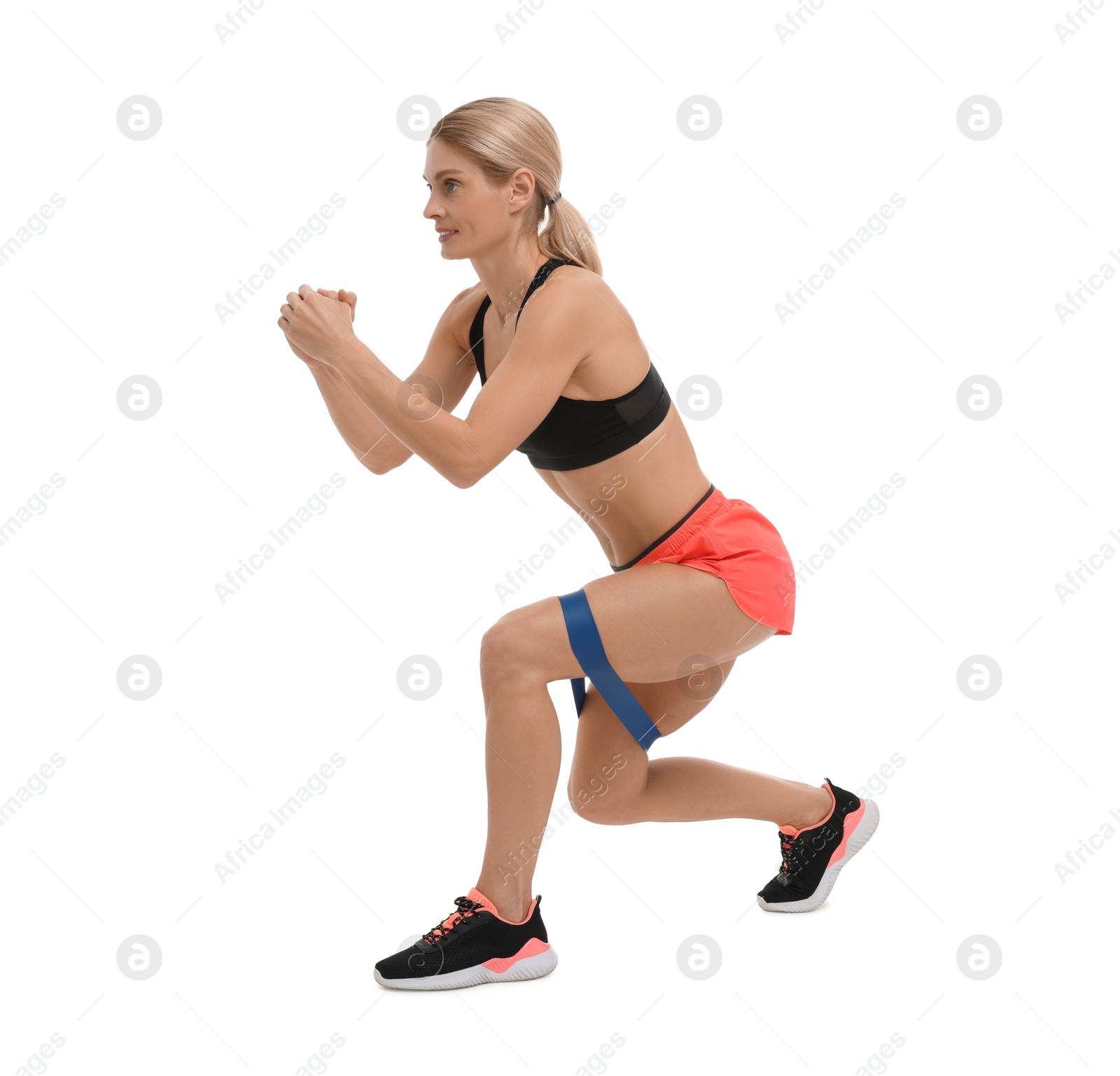 Photo of Woman exercising with elastic resistance band on white background