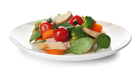 Photo of Delicious salad with chicken, vegetables and spinach isolated on white