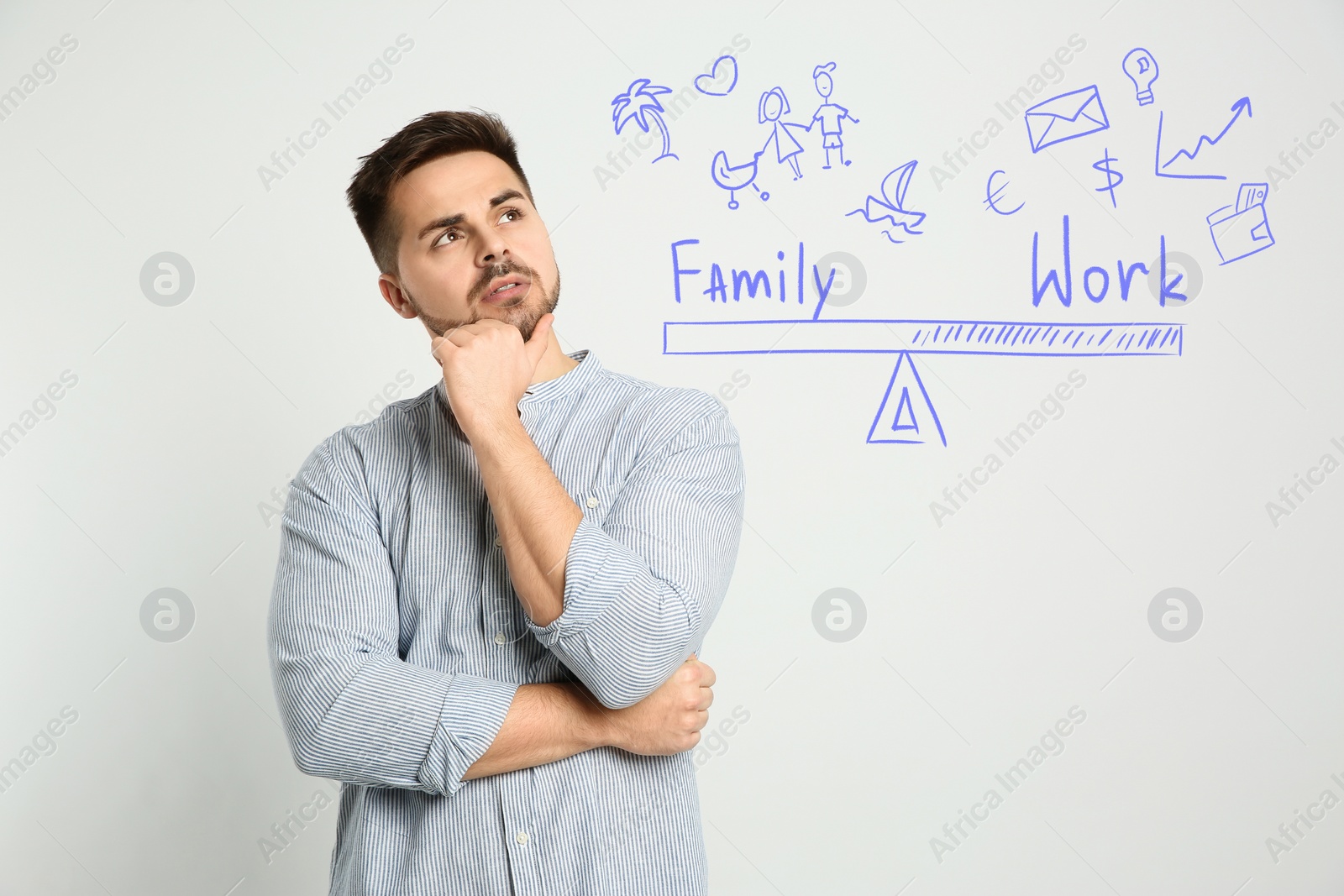 Image of Life balance. Thoughtful man making choice between family and work