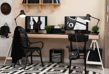 Stylish workplace interior with computers on table