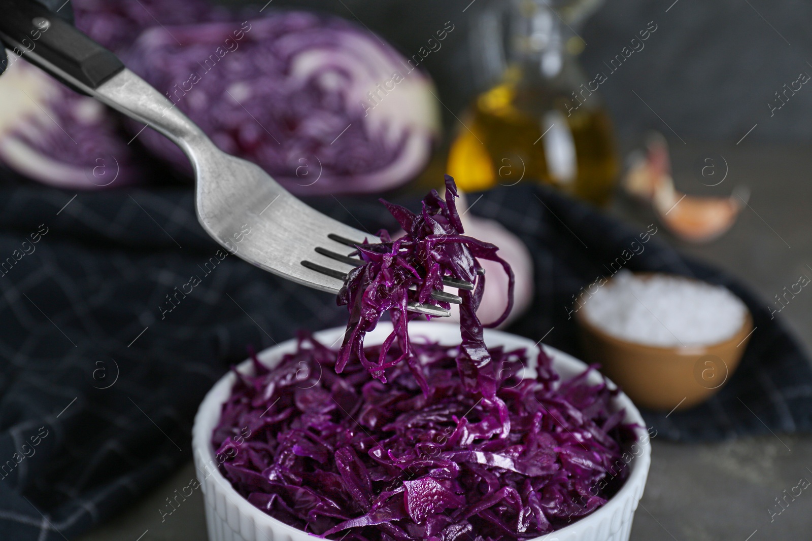 Photo of Tasty red cabbage sauerkraut on table, closeup