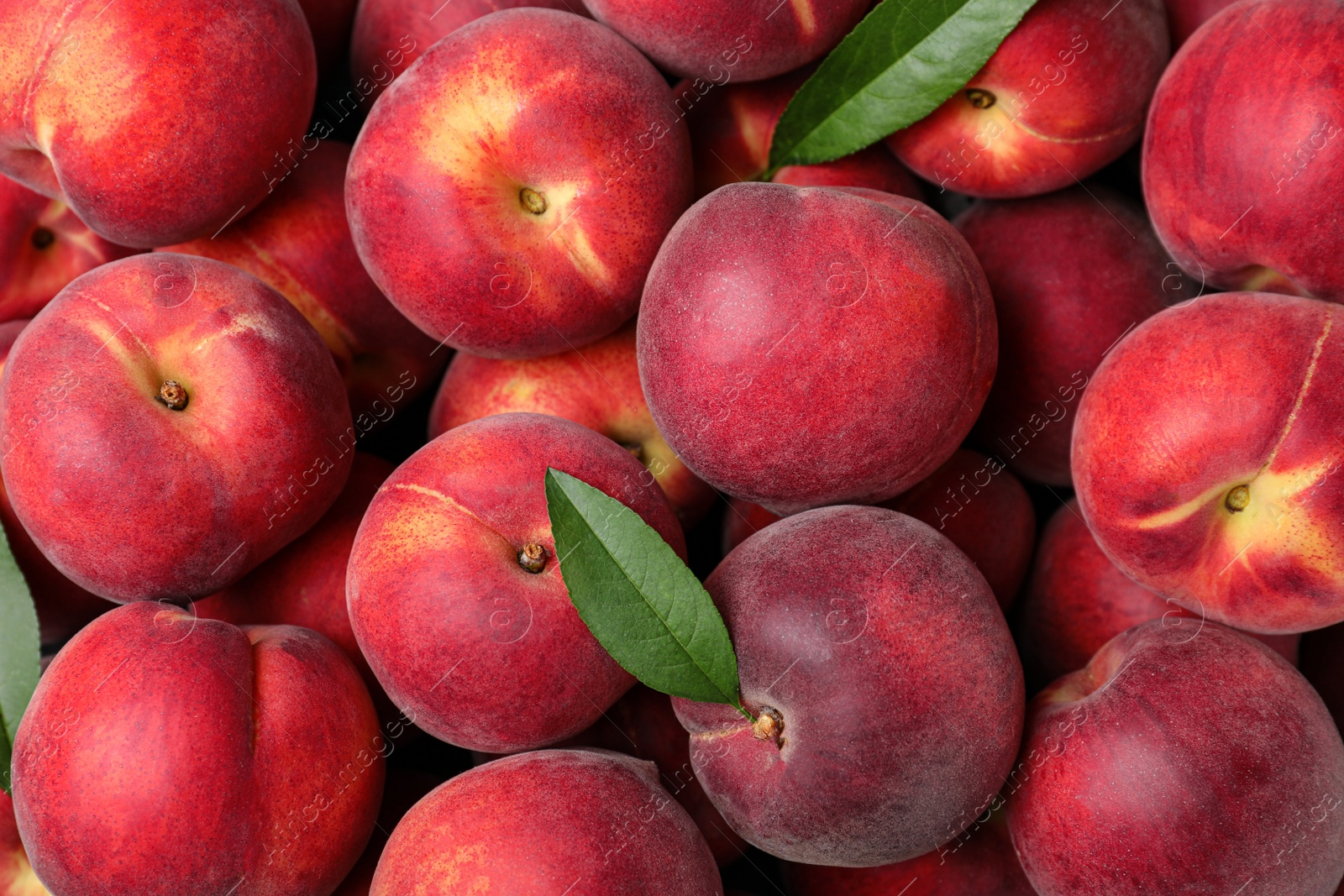 Photo of Delicious ripe peaches as background, top view