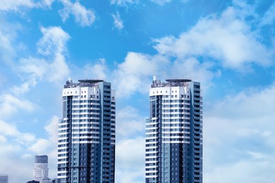 View of modern city buildings against sky