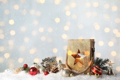 Image of Composition with wooden Christmas lantern on snow, space for text. Bokeh effect