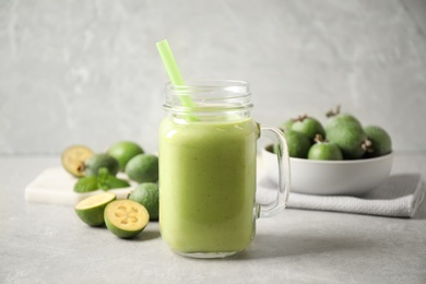 Photo of Fresh feijoa smoothie in mason jar on light table