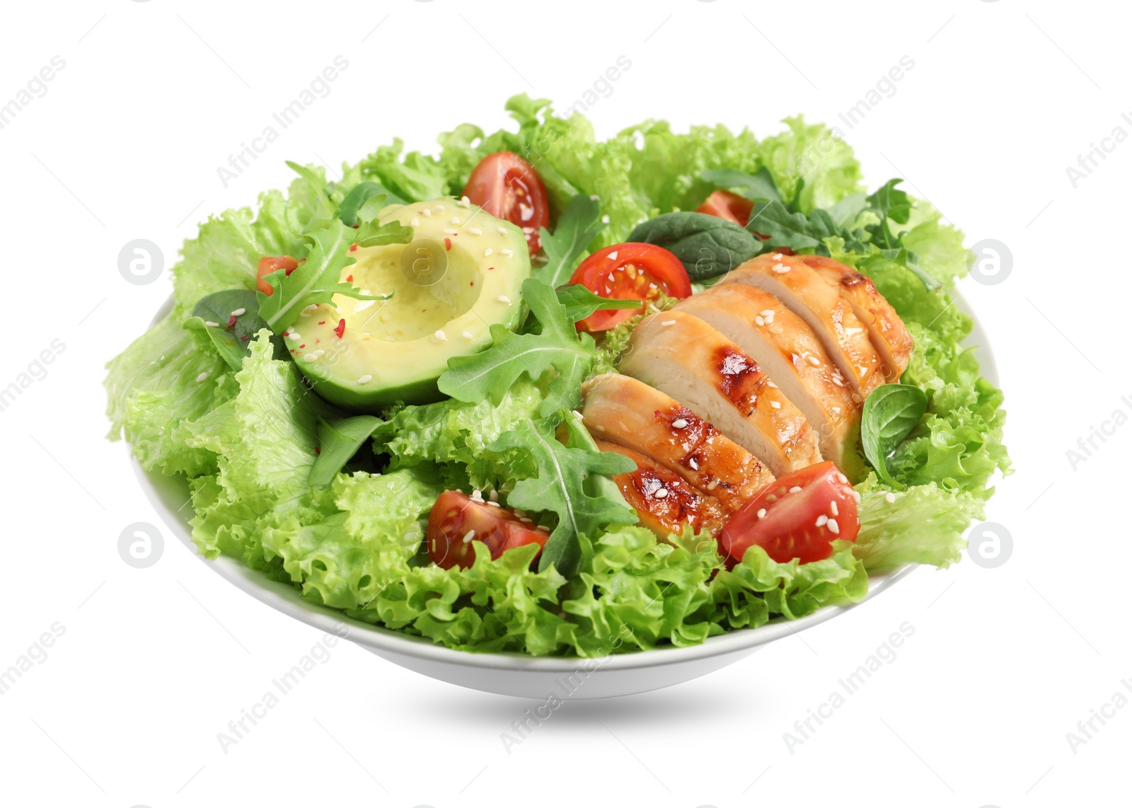 Photo of Delicious salad with chicken, cherry tomato and avocado in bowl isolated on white