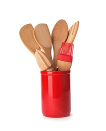 Photo of Kitchen utensils made of bamboo in stand on white background