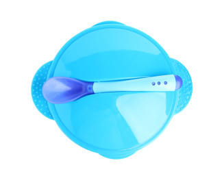 Plastic bowl with lid and spoon isolated on white, top view. Serving baby food