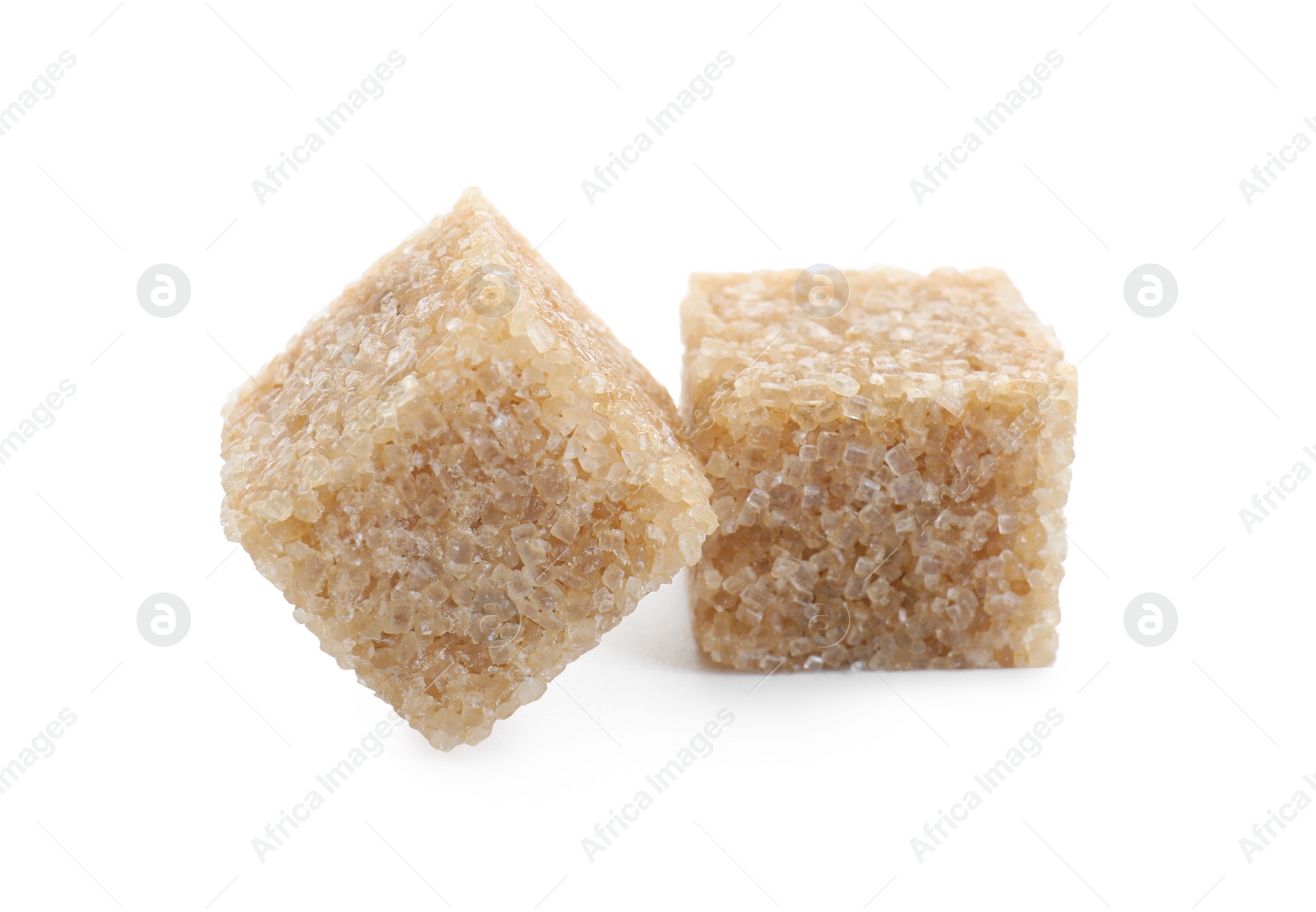 Photo of Two brown sugar cubes isolated on white