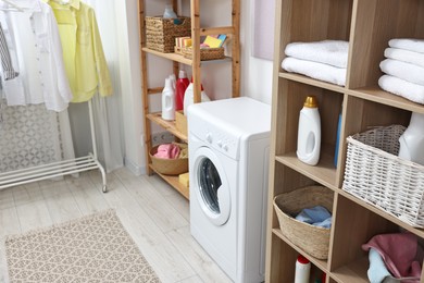 Laundry room interior with washing machine and furniture