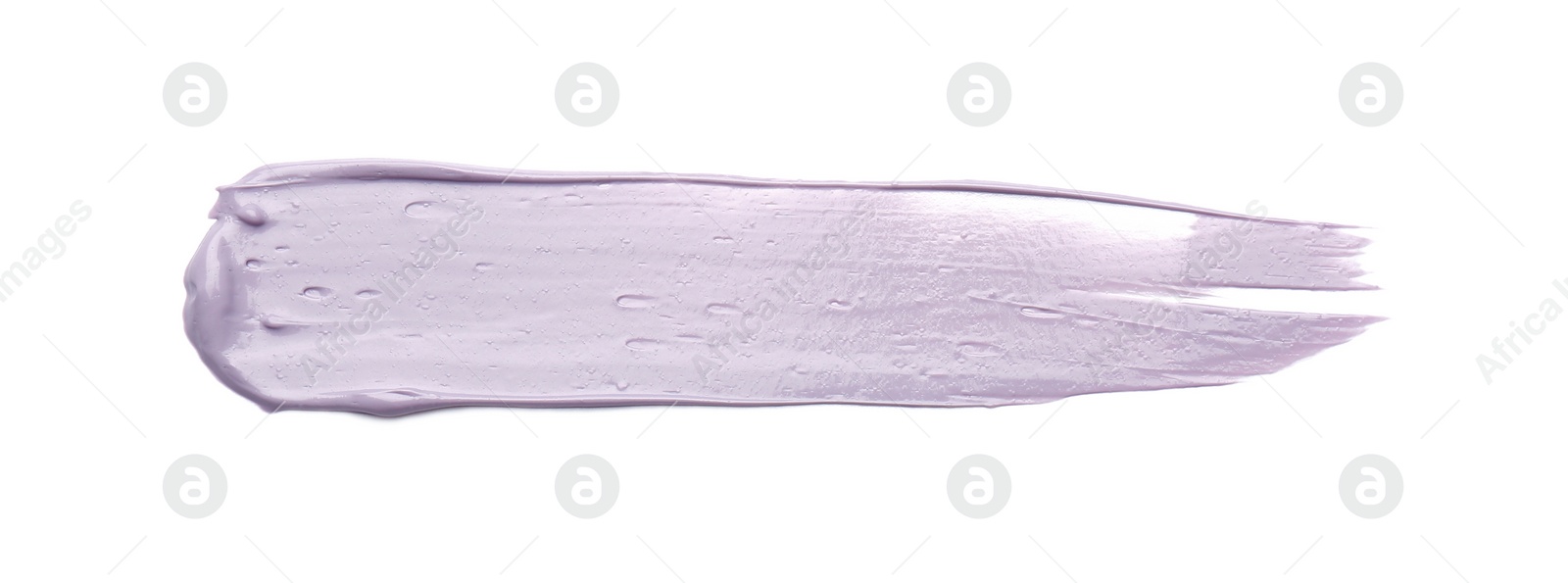 Photo of Stroke of purple correcting concealer on white background, top view