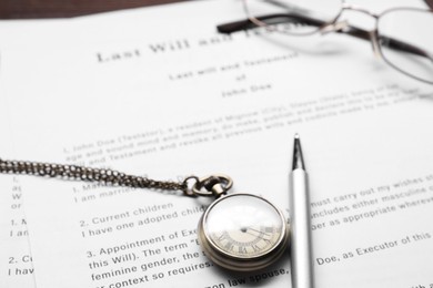 Last Will and Testament, glasses, pen and pocket watch on table, closeup