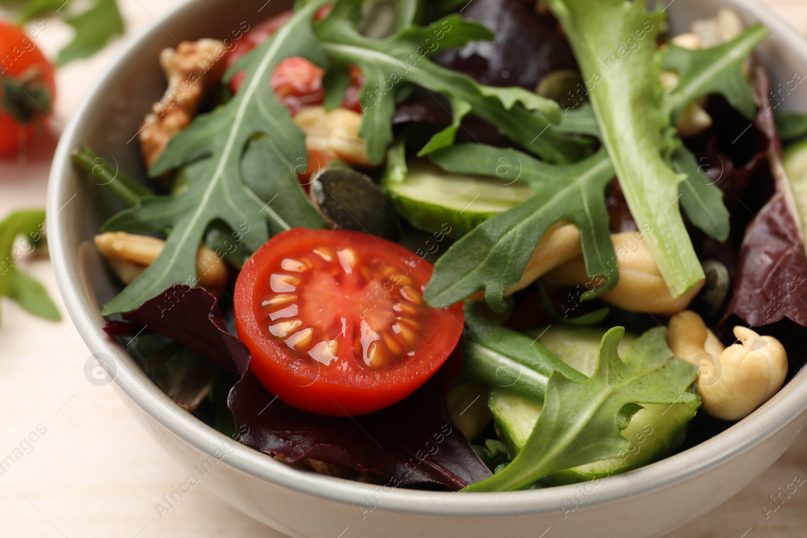 Photo of Tasty fresh vegetarian salad on table, closeup