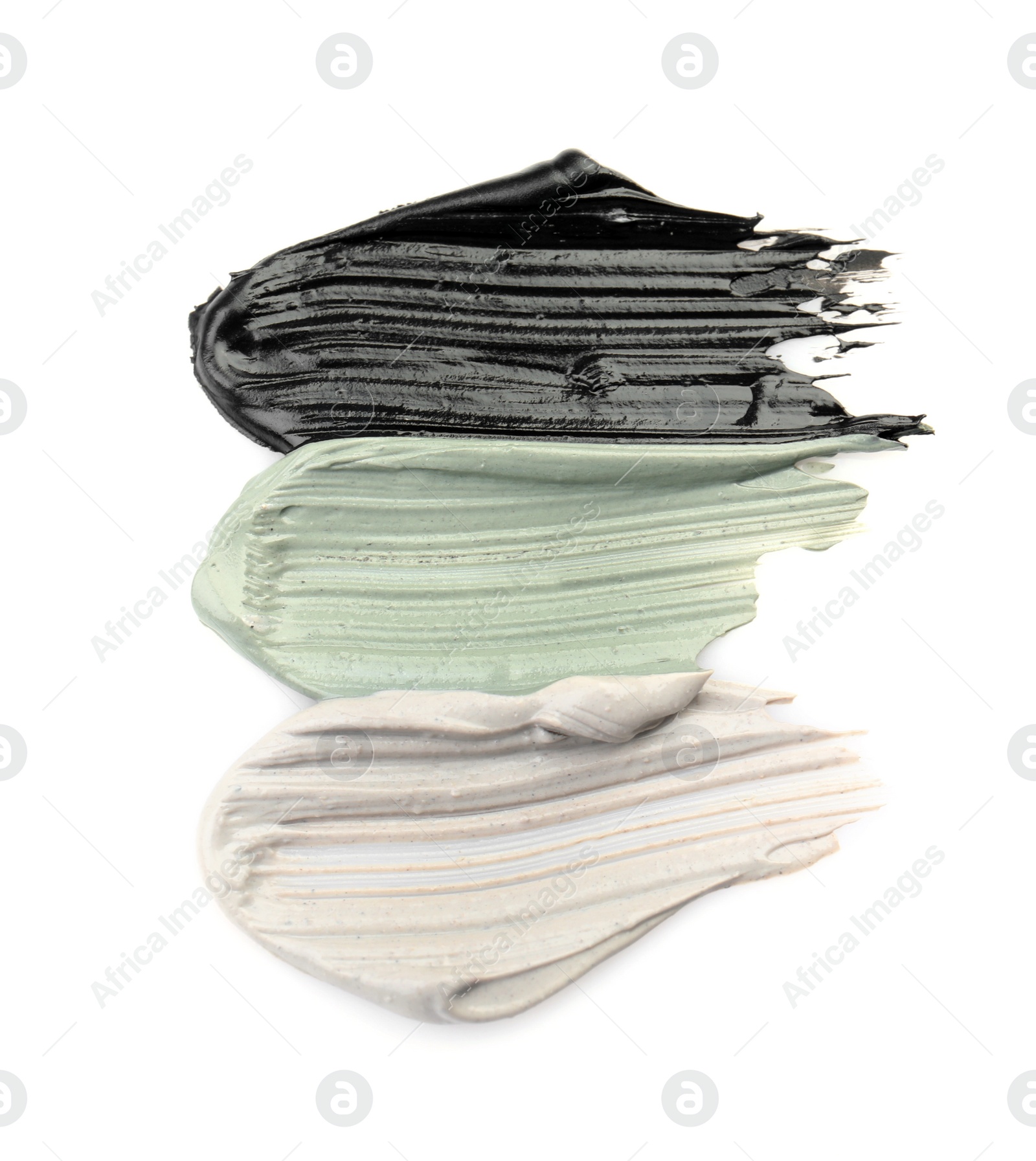 Photo of Different professional face mask smears on white background