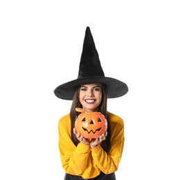 Photo of Beautiful woman wearing witch costume with Jack O'Lantern candy container for Halloween party on white background