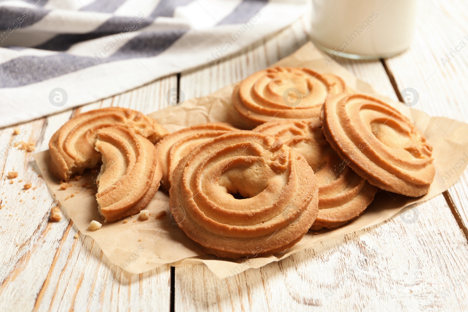 Photo of Tasty Danish butter cookies on wooden background